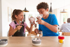 Summer Holidays Day 2 Mum, I’m Bored! Fun Ice Cream Ideas For Kids image 9 two children chinking glasses filled with ice cream Frosted Fusions